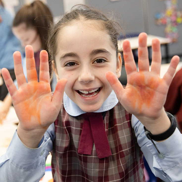 Student smiling in the classroom at St Bernadette's Primary School Dundas Valley